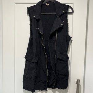 Distressed black moto vest.